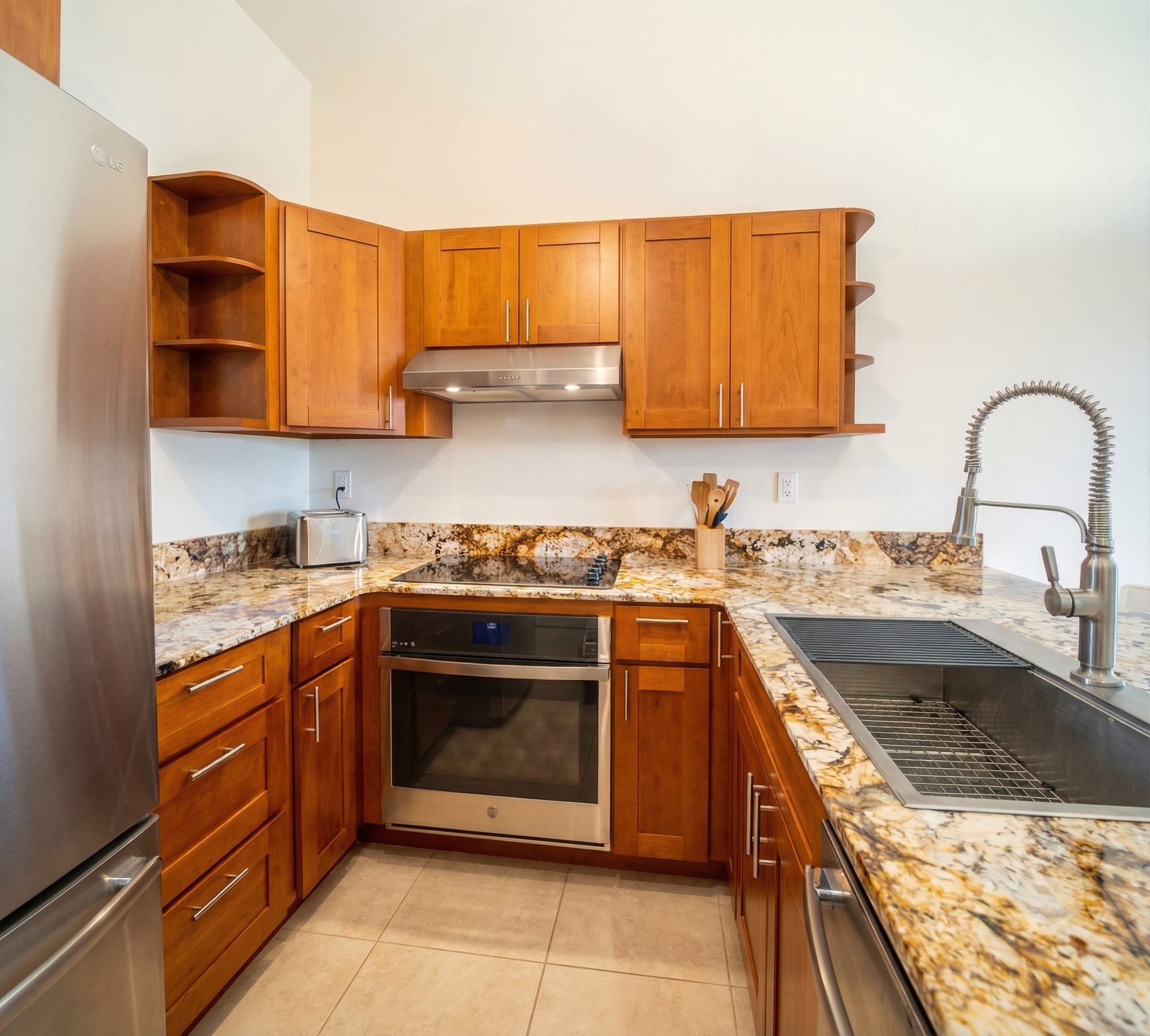 Kitchen remodel Maui by Great General LLC — cherry wood cabinets and granite countertops