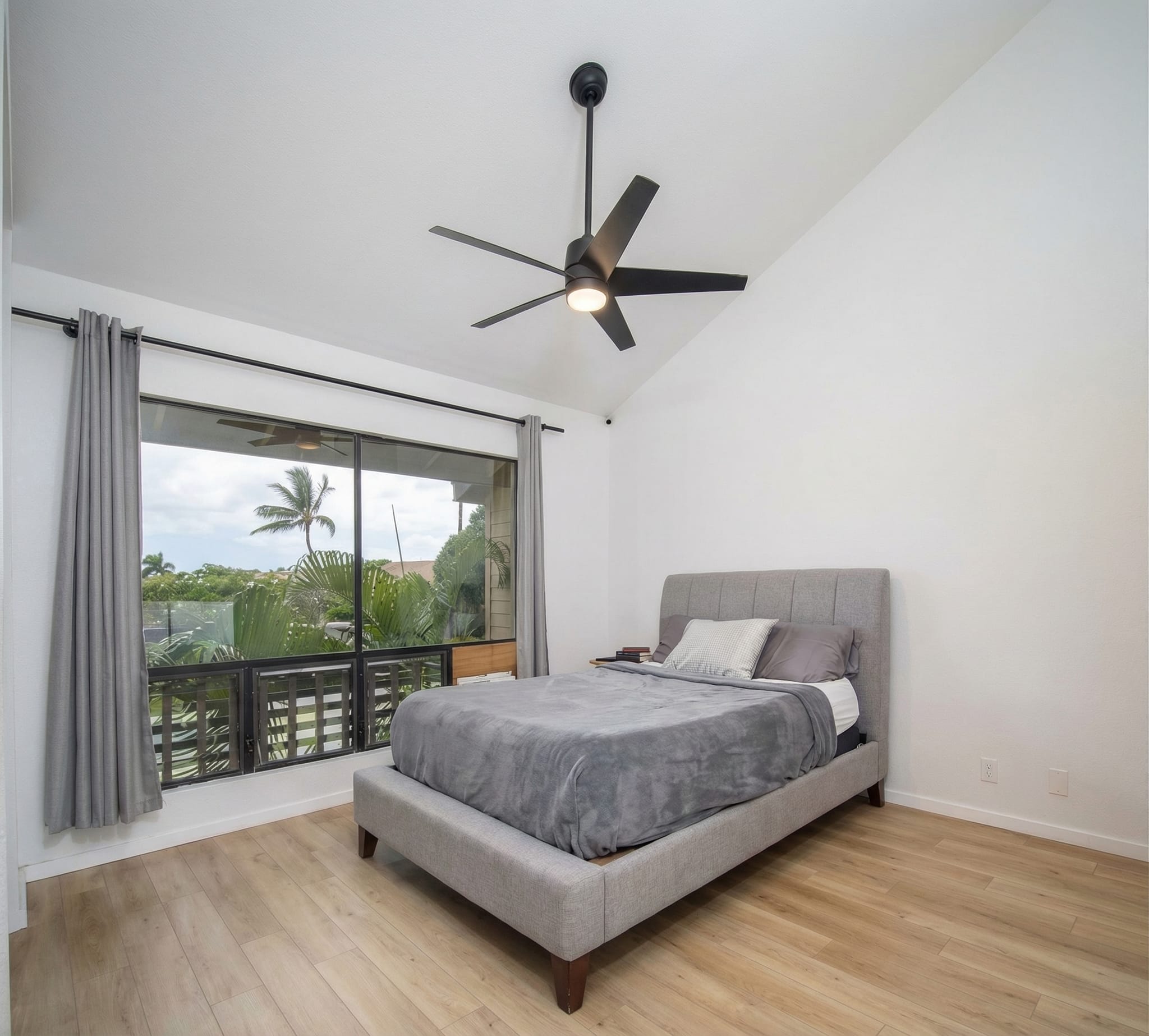Bedroom remodel Maui — vaulted ceiling, new LVP flooring and sliding glass to garden balcony