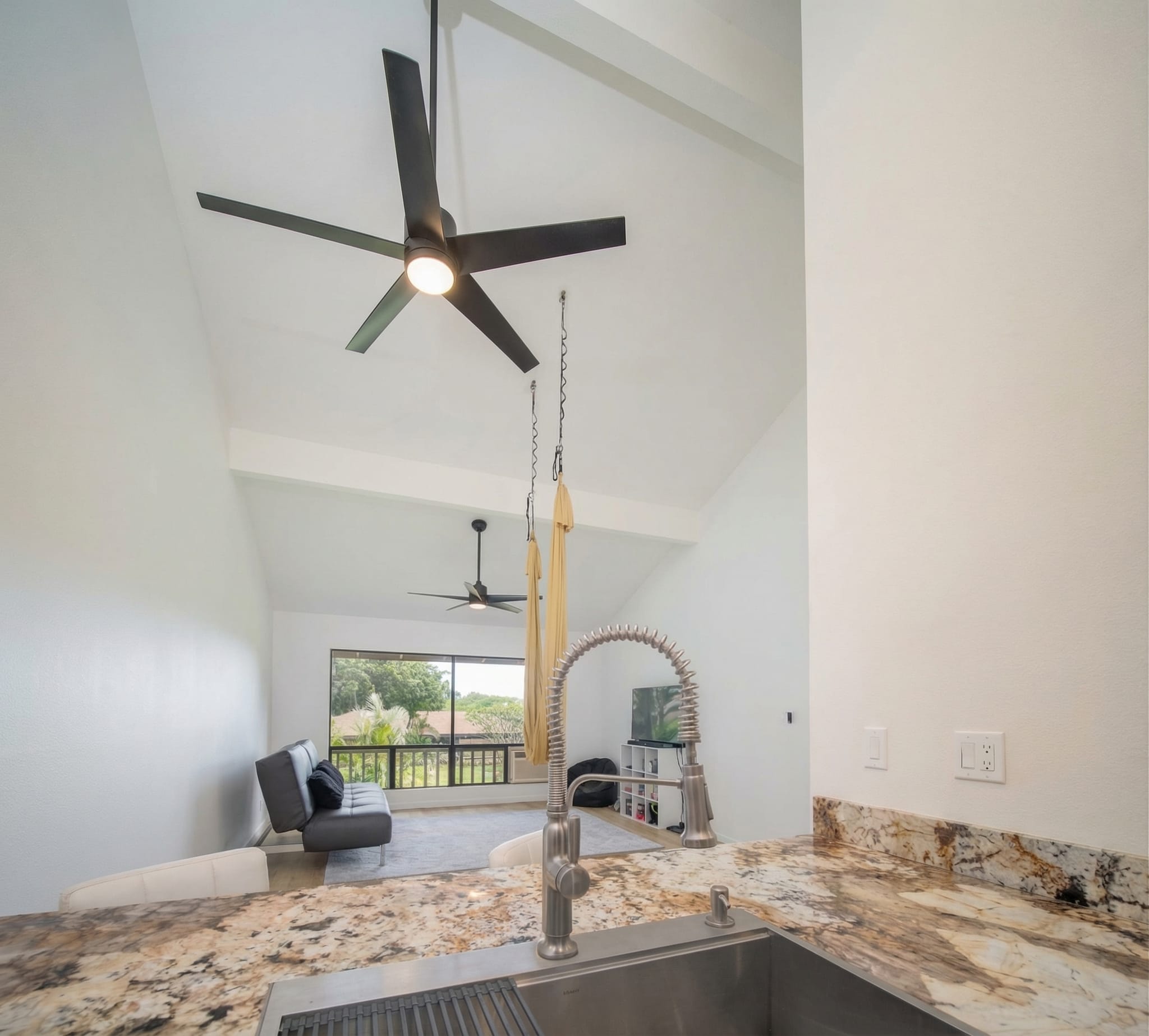 Kitchen to living room open plan remodel Maui by Great General LLC — granite counters and vaulted ceilings